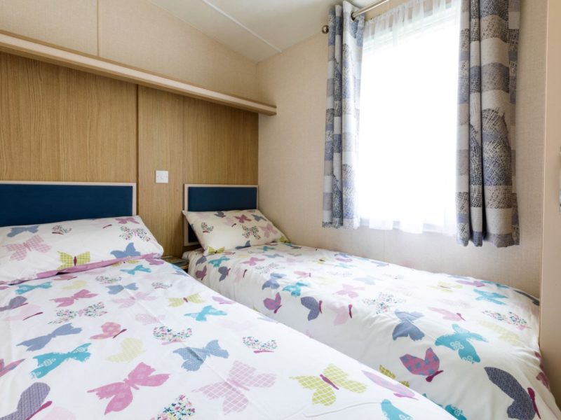 Smaller bedroom in caravan holiday home