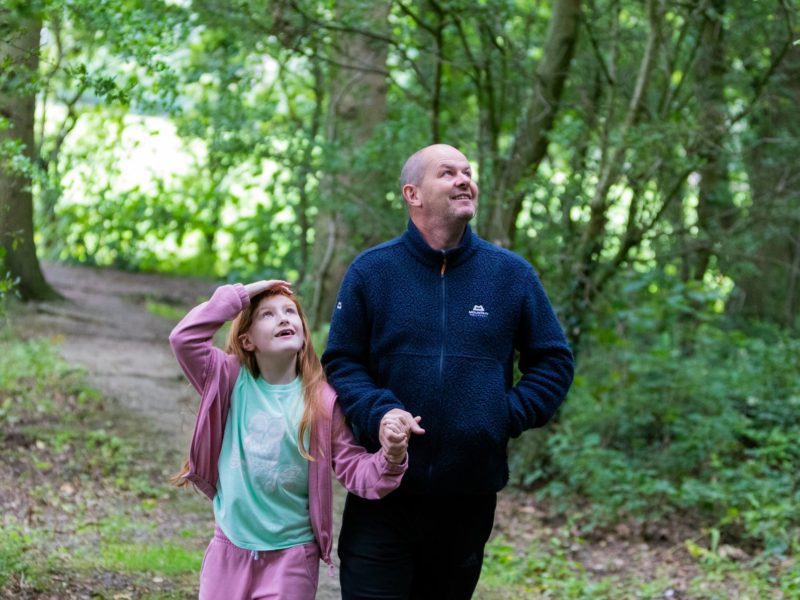 Father and daughter walk near Fylde Coast caravan park