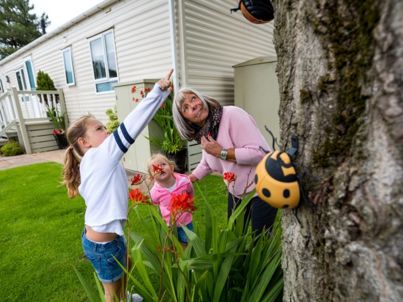 Family outside home in caravan park in Blackpool