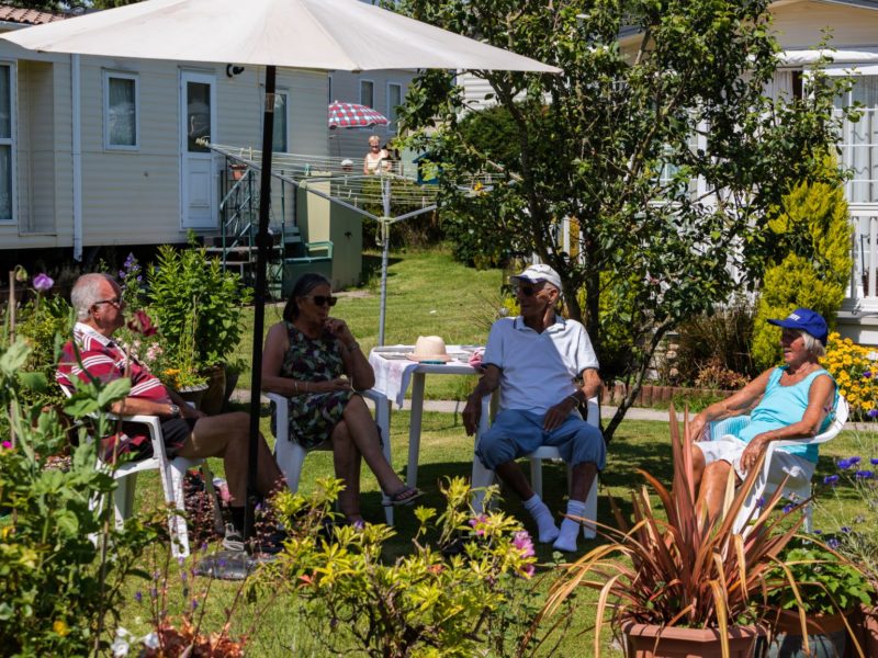 Residents sitting outside caravan park near Blackpool