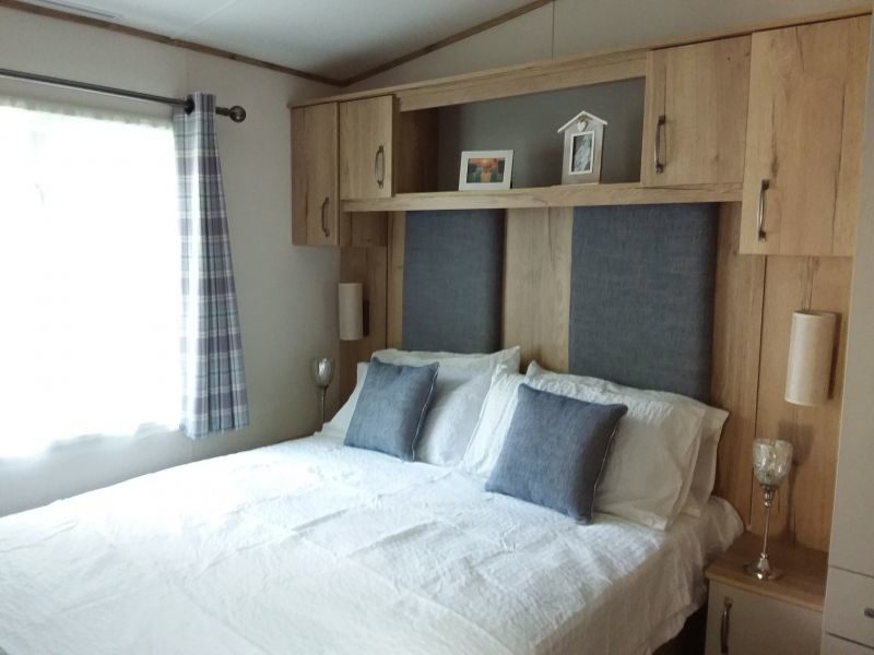 double bed bedroom in caravan holiday home