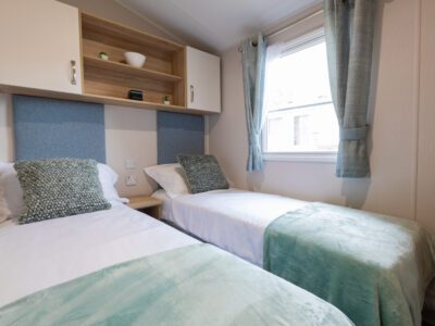 smaller single beds bedroom in caravan holiday home