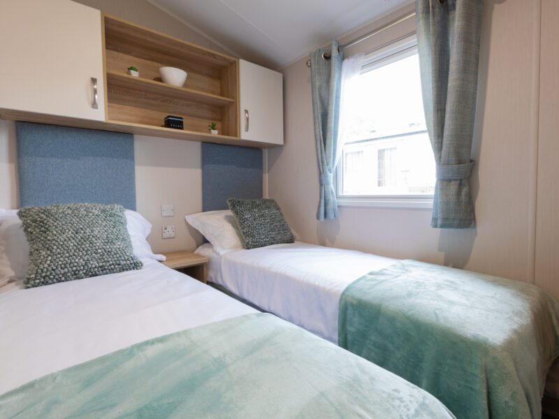 smaller single beds bedroom in caravan holiday home