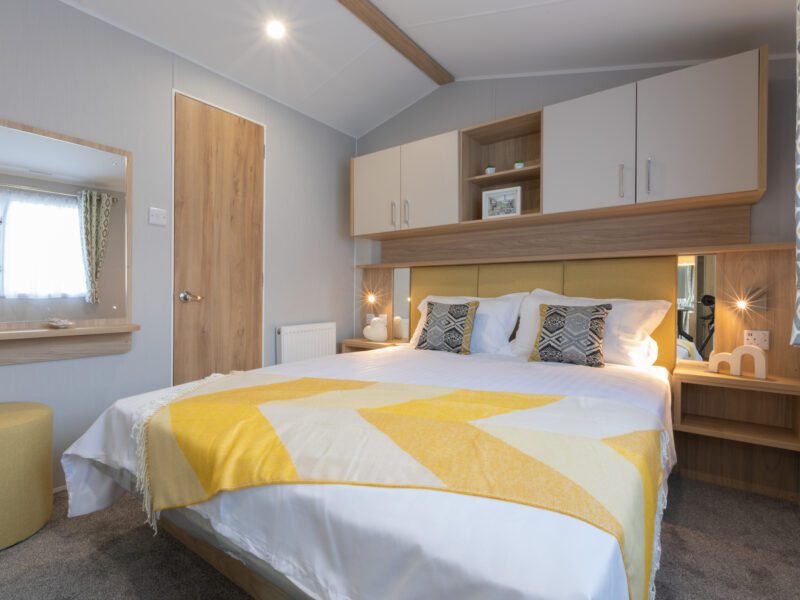 Master bedroom highlighting the luxurious accommodations in holiday parks in Lancashire.