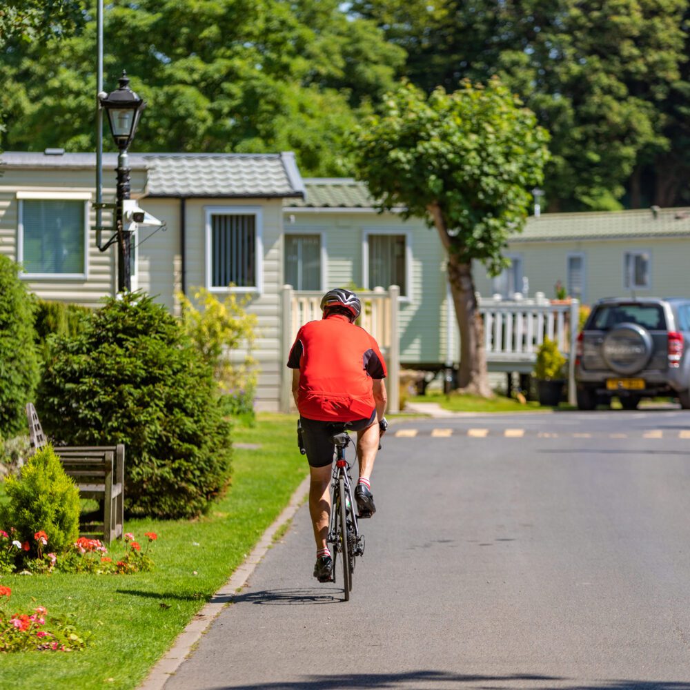 Man biking in tranquil caravan park in Lancashire